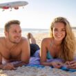 couple on beach with VS plane