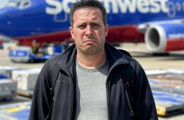 disappointed man in front of a Southwest plane